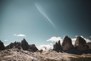 Woman with her arms outstretched, facing the Tre Cime di Lavaredo, Dolomites, South Tyrol, Italy Woman with her arms outstretched, facing the Tre Cime di Lavaredo, Dolomites, South Tyrol, Italy